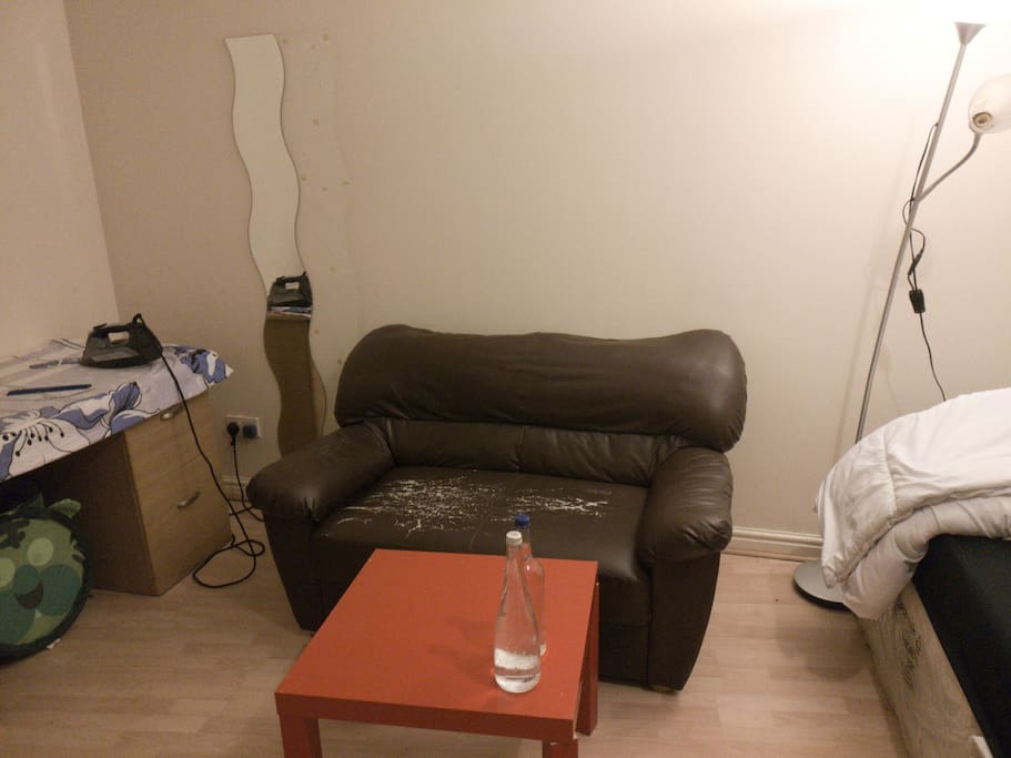Sofa with table in bedroom