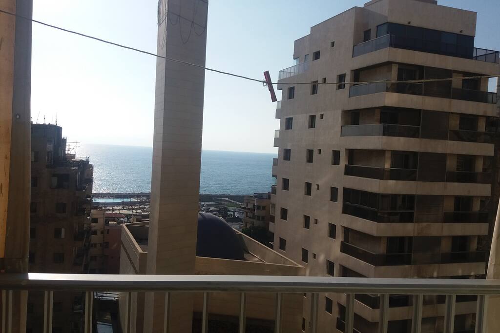 Balcony with tables and chairs open with sea view