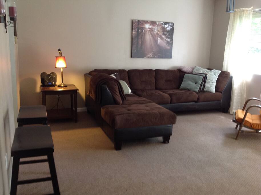 El Shaped couch great for relaxing, tv or extra guests.
