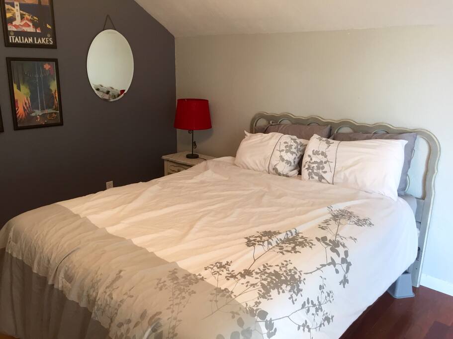 This is a queen bed: the headboard is a restored New Orleans antique.