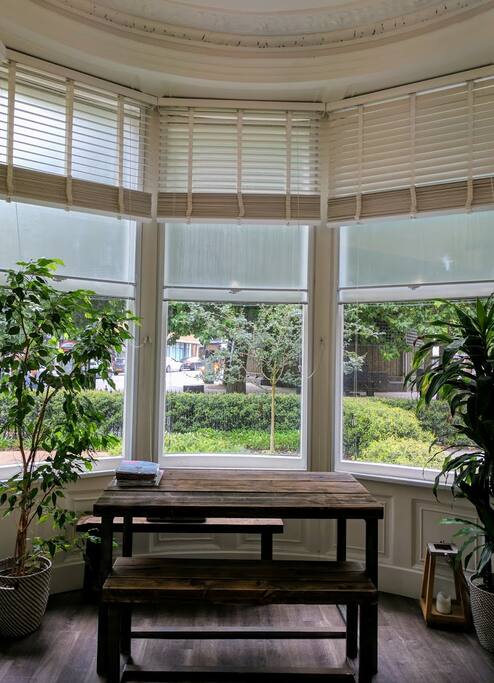 Dining table with bay window and lots of natural light!