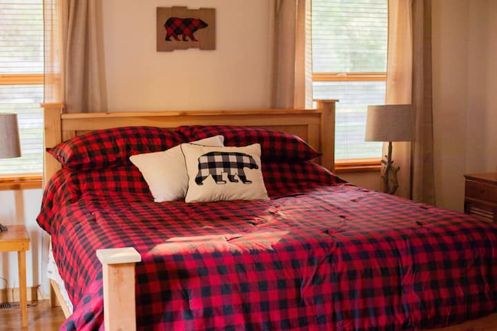Deluxe handmade king sized bed. You'll want to spend an extra night just for this.