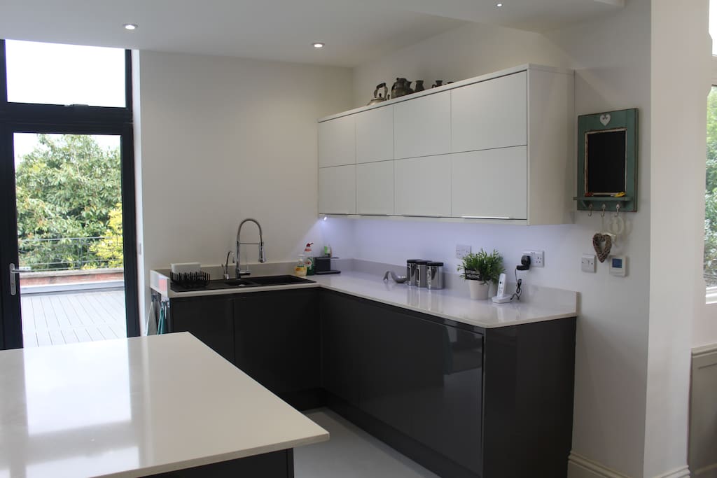 Kitchen washing up area including hot water and filtered cold water tap