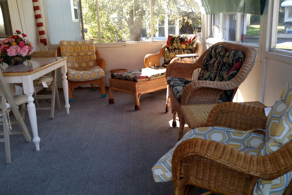 Front porch area, fully screened and lighting for evening use.