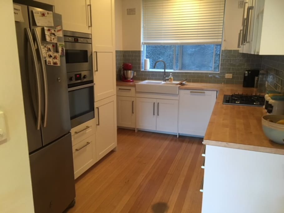 Renovated kitchen with fridge (water cooler), oven, microwave, dishwasher and stove top