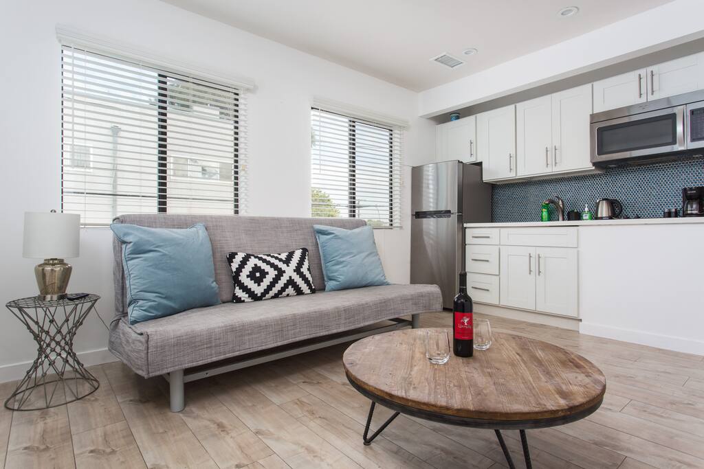 Spacious living room/kitchenette features sleeper sofa
