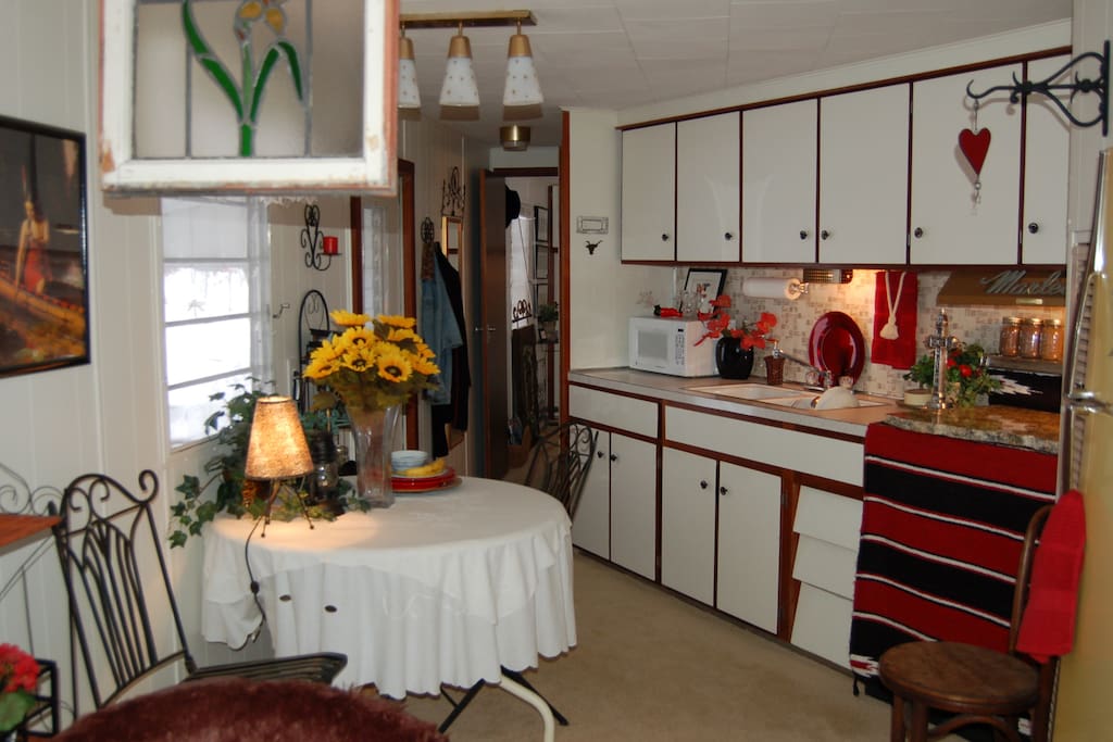 Galley kitchen with full refrig, microwave - no stove