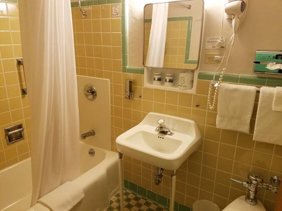 Original tiling in private bathrooms with tub and shower. Shampoo, conditioner and soap all provided.