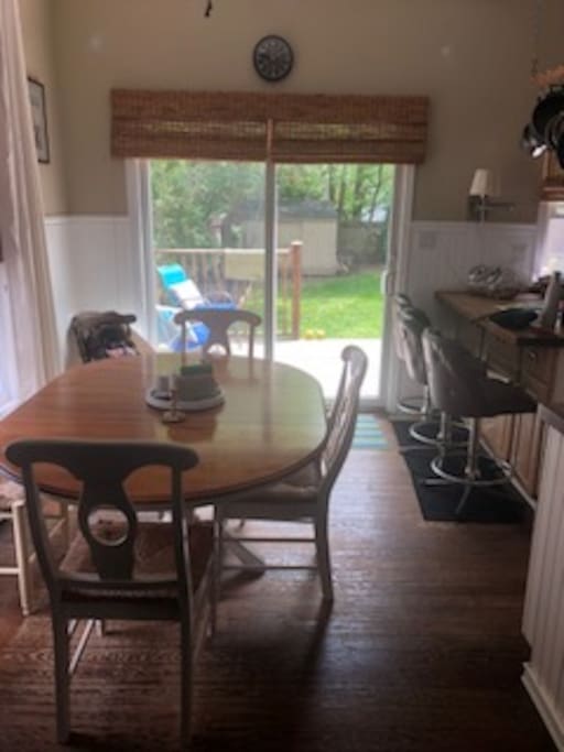 Open dining room with access to the deck and private backyard through sliding glass.