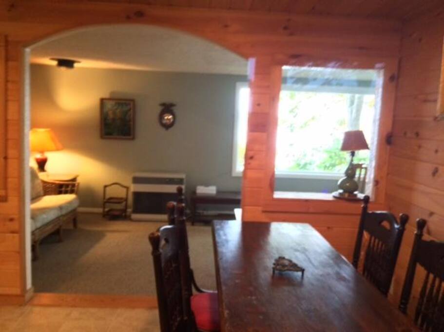 kitchen table view of living room with lake view