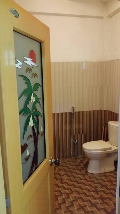 Bathroom with hot shower and western toilet