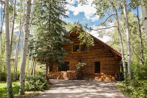 Classic log cabin on river in Redstone.