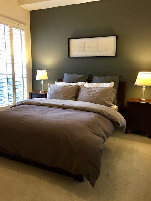 Guest bedroom with a queen size bed.