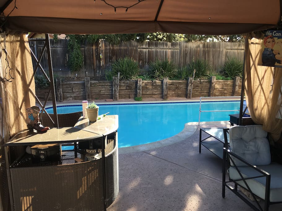 Shared patio, bar, and pool