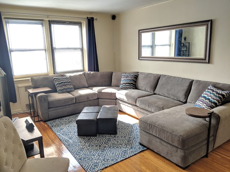 Large, plush sectional couch! Drenched with sun in this top floor apartment.