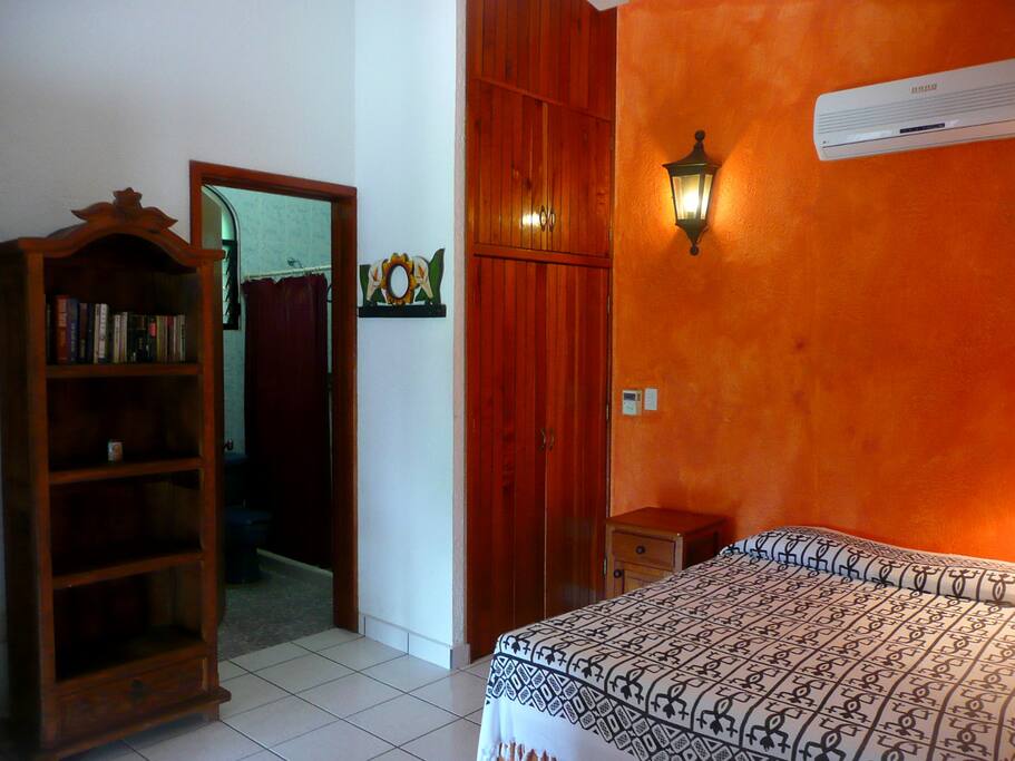 Bookshelf and double bed are provided