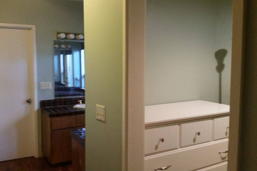 Walk in closet with drawer.