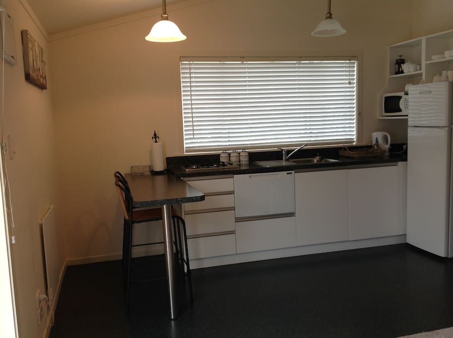 Self contained kitchen with breakfast bar