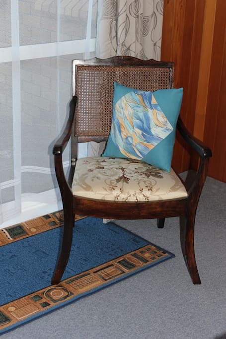an antique chair in the bedroom