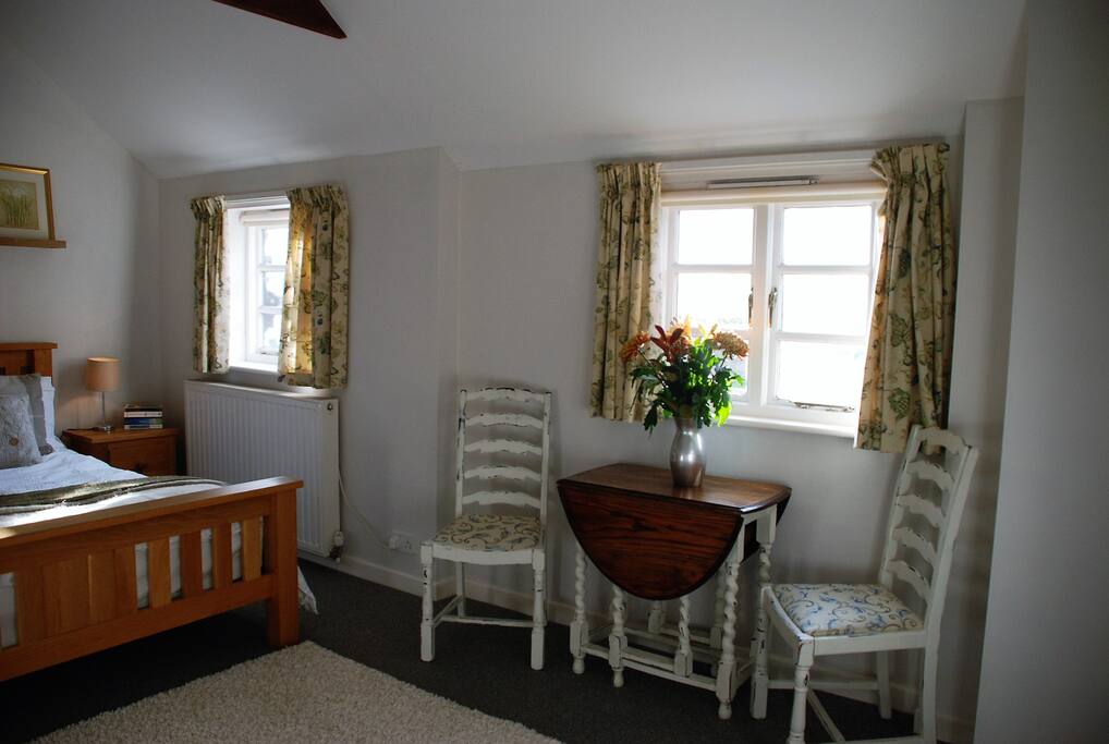 bed/sitting room with seating