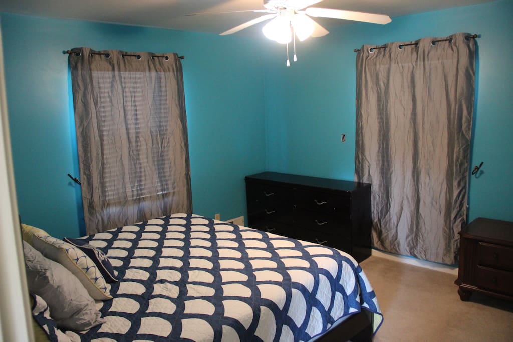 Upstairs bedroom with king bed and closet