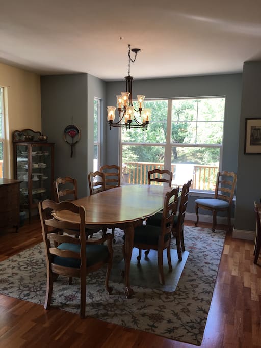 Spacious dining room open with view into kitchen for easy entertaining