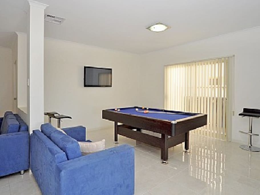 Rumpus room with TV and DVD, pool table that can be converted to a table tennis table