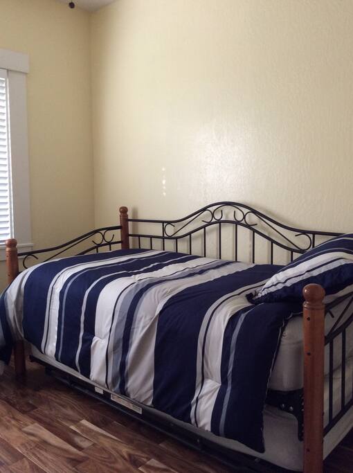 Twin bed in small bedroom.