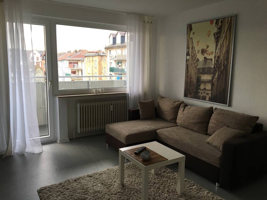 Living room and couch with bed function.