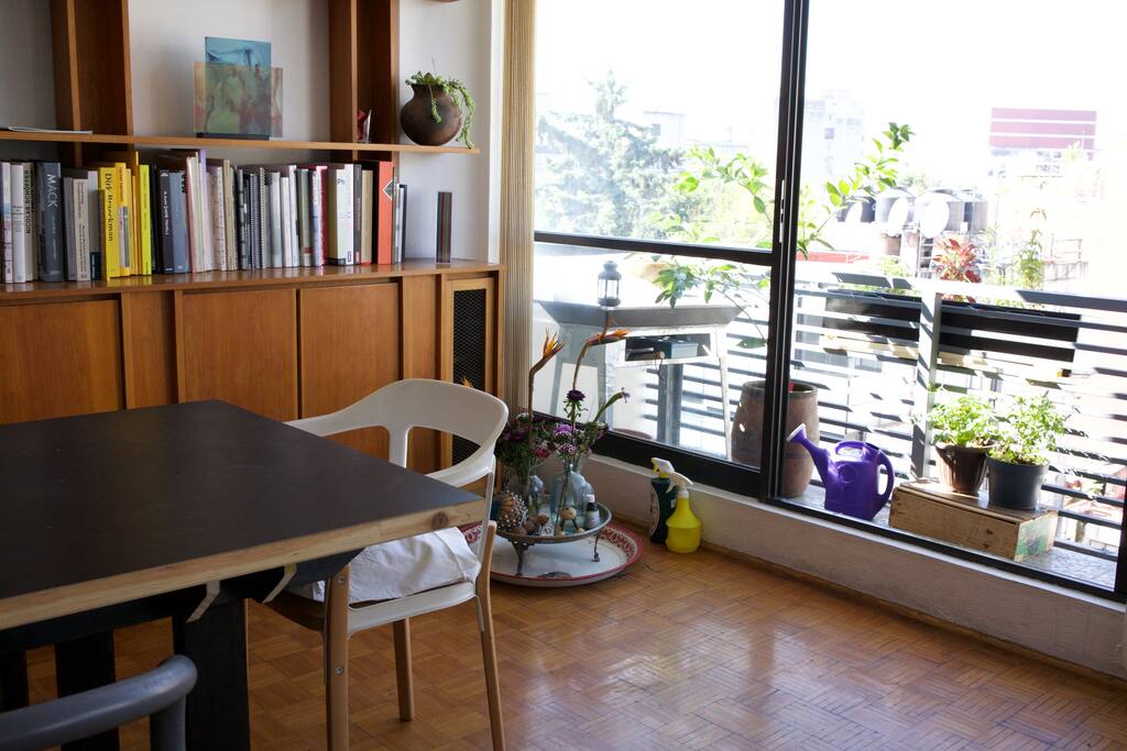 book shelves living room and big table + entrance to balcony