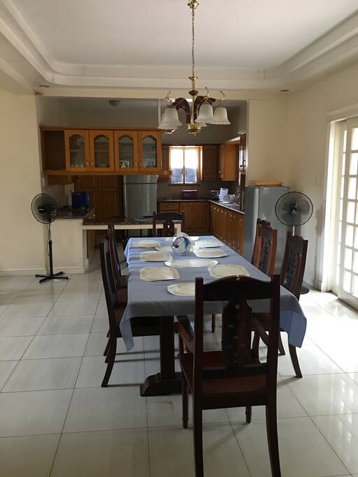 The dining room with table for 8 and the kitchen at the back! Shared.