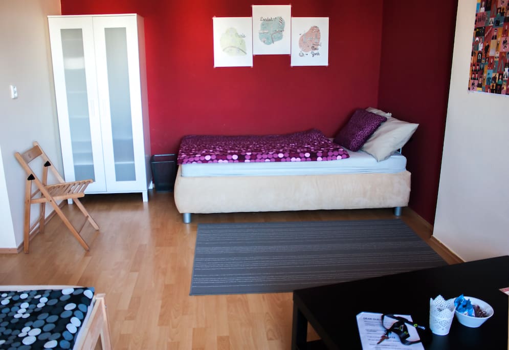 Bigger single bed or double bed for a couple. Towels and slippers in the closet.
