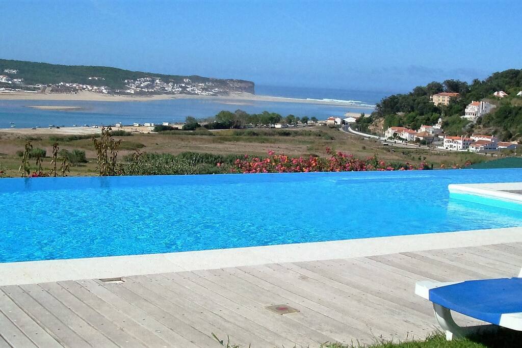 Large heated pool measuring 16 x 5 meters, with kids pool area and solid transparent fence protrection