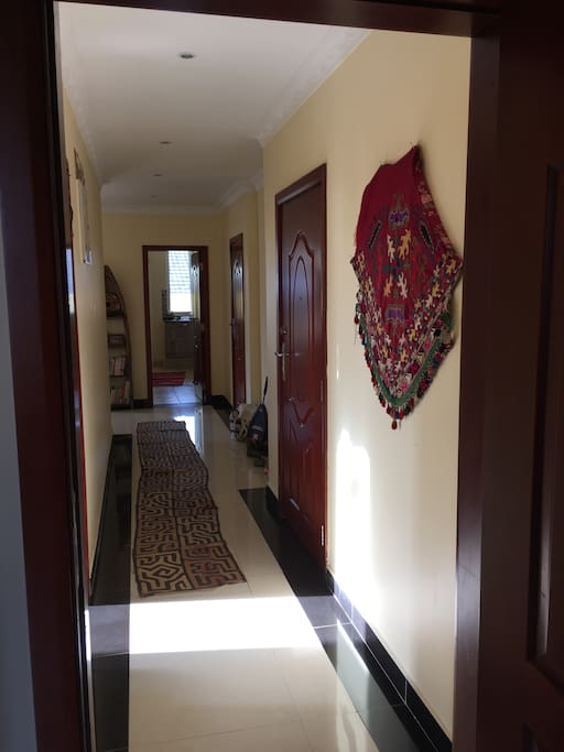 hallway from guest bedroom to kitchen and living room