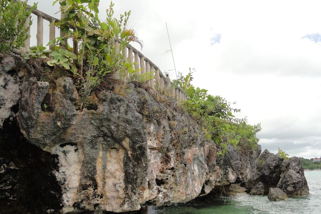 Preserved natural limestone cliff.