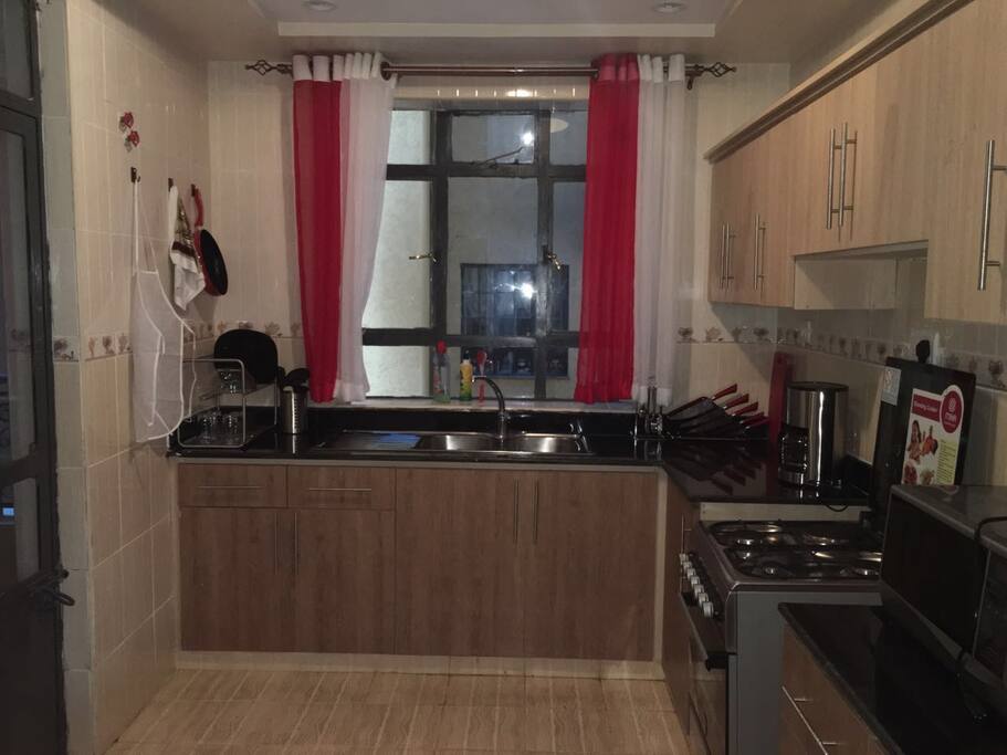Spacious fully equipped kitchen. Hot water in the sink. Fridge, microwave, gas cooker, coffee maker and adequate utencils for cooking