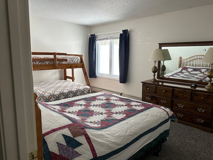 Bedroom #2 offers a queen size bed and a twin over full bunk bed.
