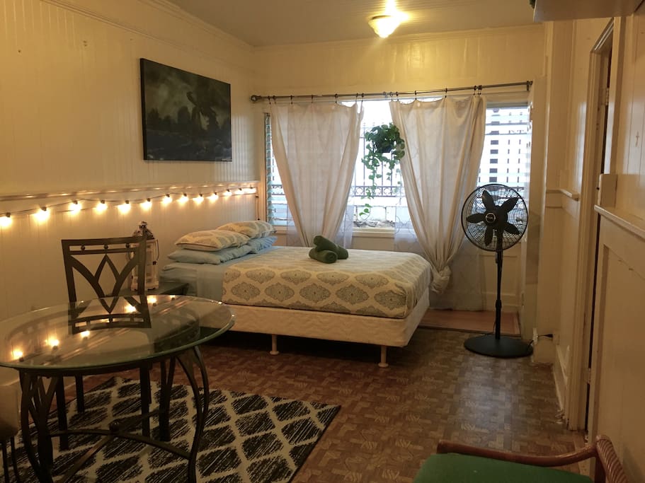 The Living Room features a full size bed and Bistro dining set.