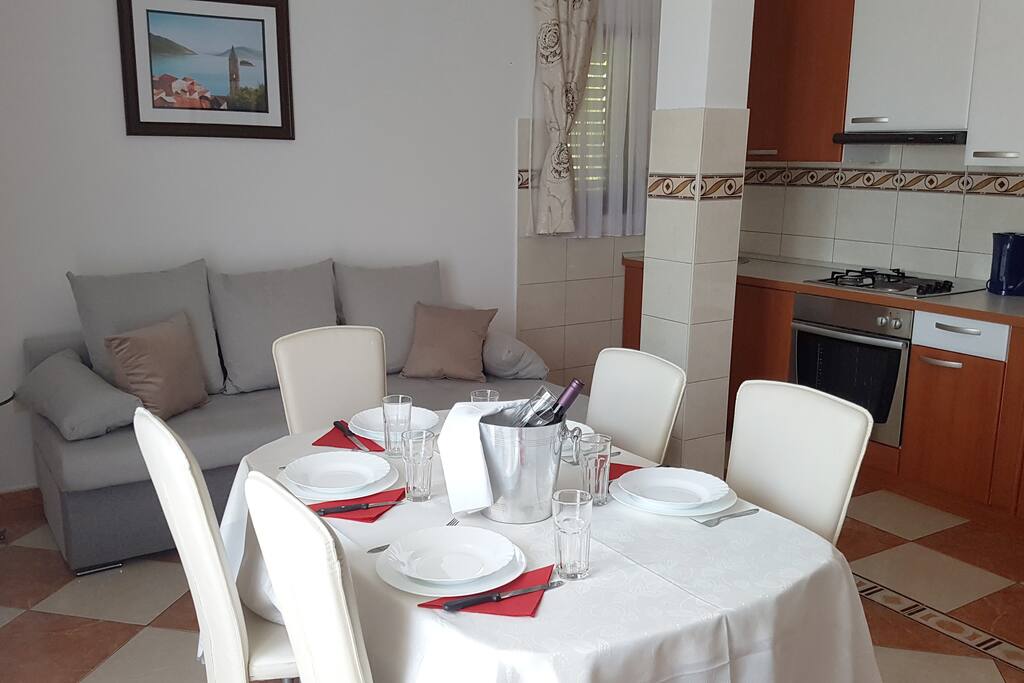 The open space living room with fully equipped kitchen where you can prepare your meals. Ceramic floor without carpets to provide allergies. Every window has blinds that can darken the room.