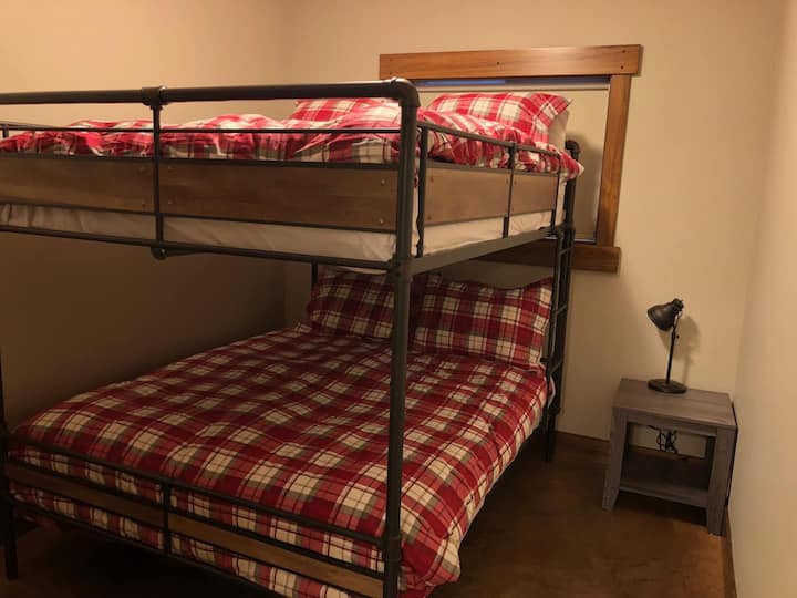 A queen size bunk bed allows for families to share
