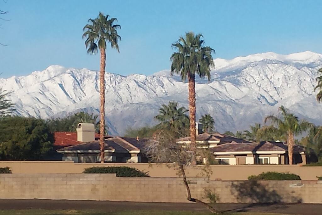 Snow covered west mountains view from back patio