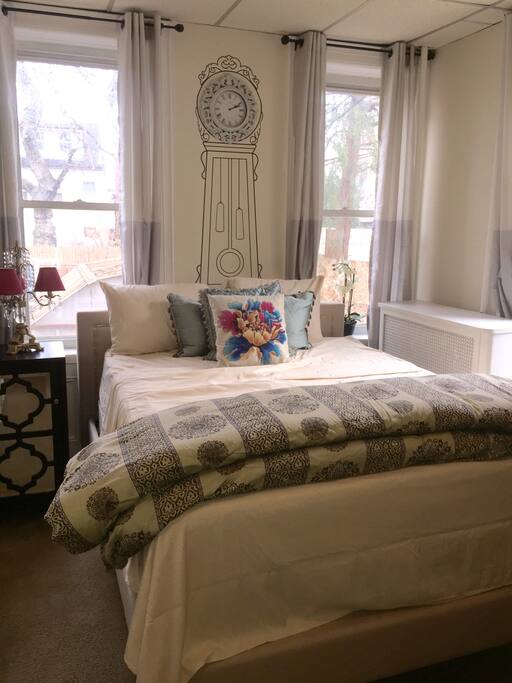 Beautiful bedroom with lots of natural light, Comfortable queen sized bed.