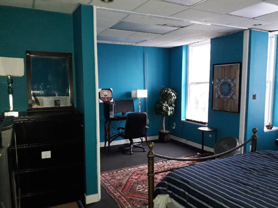 Room provides WiFi and desk space for working.