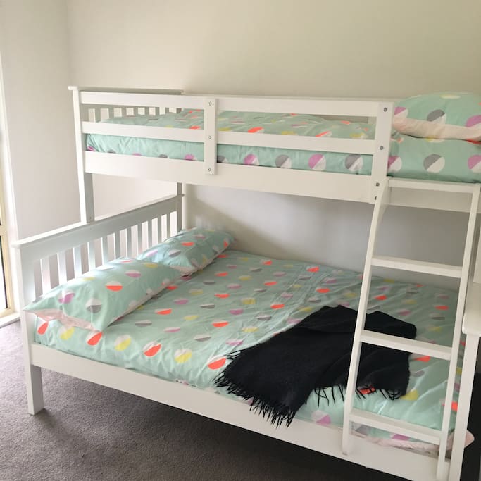 Fourth bedroom with double/single bunks and flat screen TV mounted and hidden in the robes. Ideal for the kids!