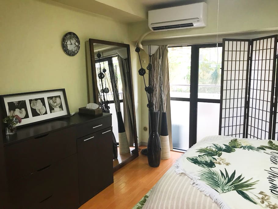 The bedroom overlooks a balcony. Great to a fresh breath of air! There is also tons of storage space.