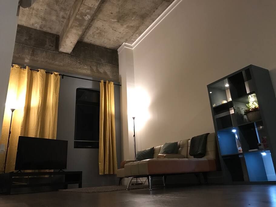 Lovely living room with high ceiling.