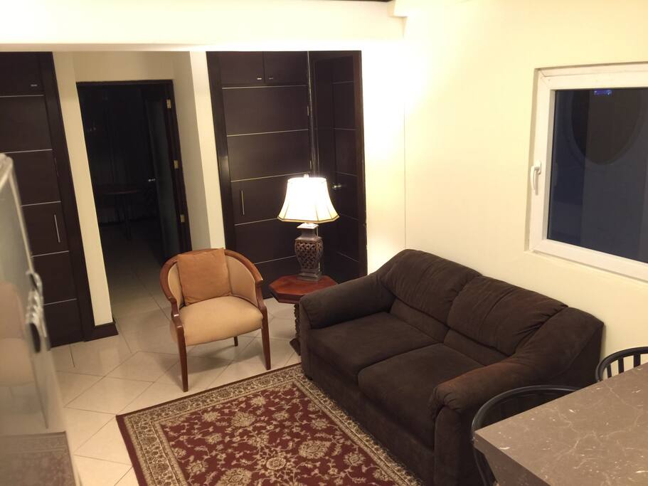 Separate living with full size sofa bed.