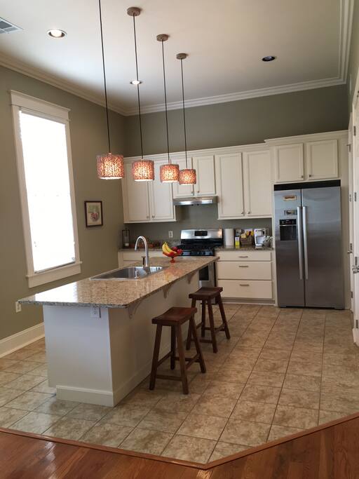 Open Kitchen with Bosch stainless appliances, opens to the dining area