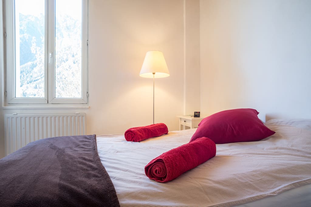 Double bed with wardrobe and storage, view of the mountains.