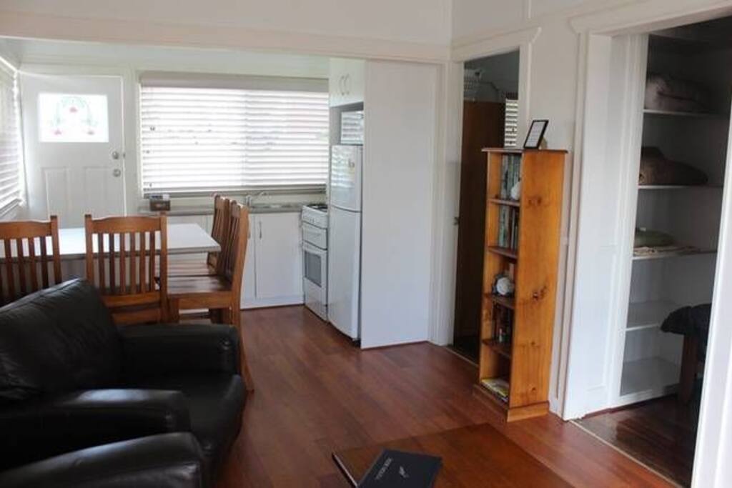 A kitchen with fridge, stove, oven and microwave